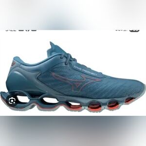 Size  11.5Mizuno men's blue running shoe with orange accents Retail 250$
